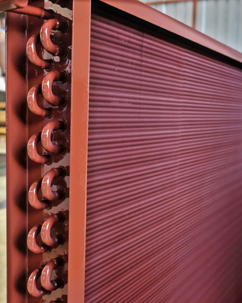 Close,shot,of,copper,plain,tubes,of,a,condenser,coil