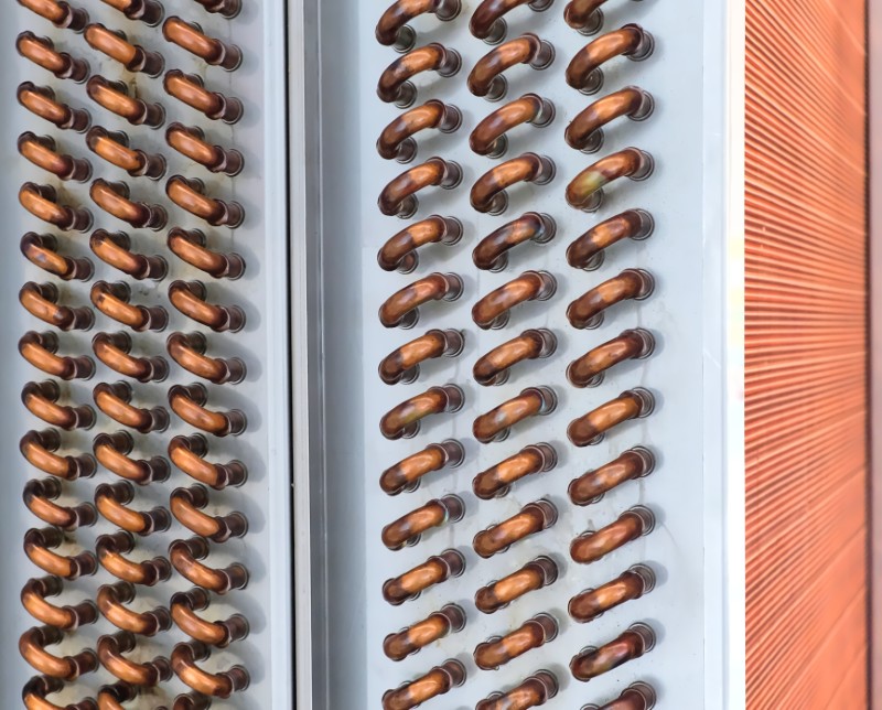 Close,shot,of,copper,plain,tubes,of,a,condenser,coil.